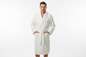 an adult man wearing a fluffy luxurous bathrobe